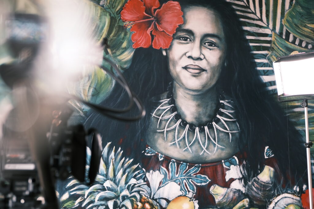 poster of a polynesian woman on the wall of Mama's Polynesian Soulfood Minto Campbelltown
