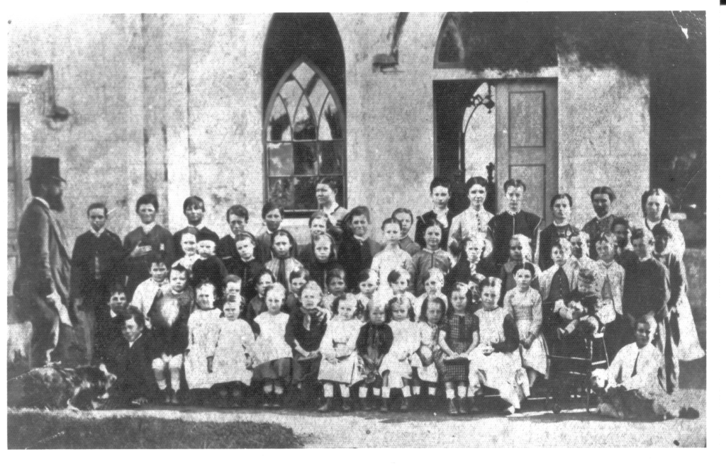 Schoolchildren outside St. Patrick's Catholic School Quondong - ca. 1870 - 1889 - Credit - Campbelltown and Airds Historical Society